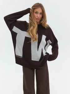Brown knit sweater with white TM letters and Since 2017 print in a loose fit