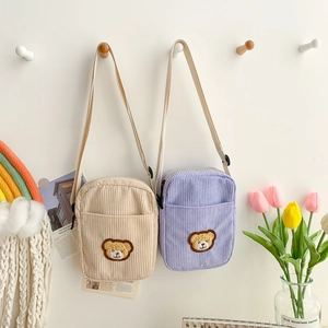 Corduroy bear shoulder bags for kids in beige and purple colors with adjustable straps