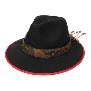 Detail of western cowboy hat with a metal bull head buckle and red stitched brim