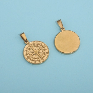 Gold stainless steel compass pendant necklace showing front and back view on blue background