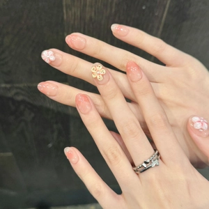 3D plumeria press-on nails with peach gradient finish and delicate pearl accents