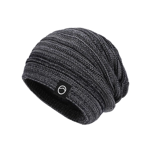 Winter marled grey knit beanie for women with warm fleece lining and mountain logo patch