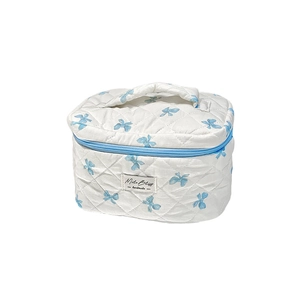 Trousse de maquillage matelassée à motifs nœuds bleus avec poignée de transport