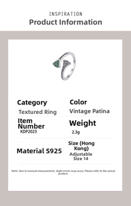 Detail view of S925 sterling silver ring with green zircons and vintage wave texture