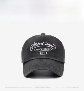 Detail of embroidered NYC Allstar Game text on washed dark grey baseball cap