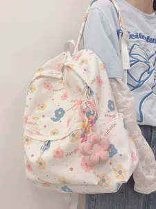 Floral print canvas backpack for girls with cute flower plush pendant and multiple pockets