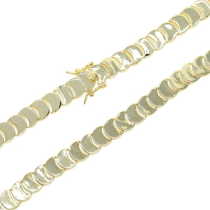 Detailed view of the golden flat scale chain link necklace with a secure box clasp