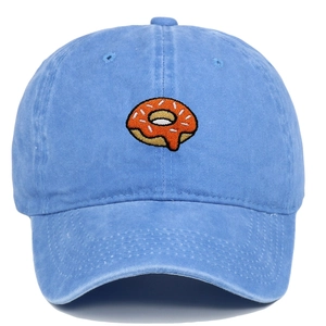 Detailed embroidery of a colorful donut on a light blue washed cotton baseball cap