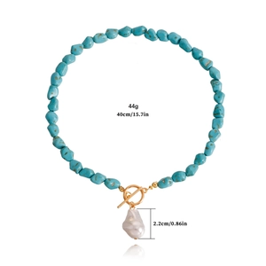 Irregular turquoise bead necklace with unique baroque pearl pendant and gold OT clasp