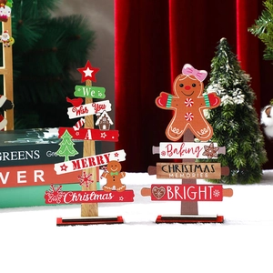 Wooden Christmas gingerbread man and tree tabletop ornaments with festive lettering