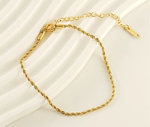 Detailed close-up of 18k gold plated stainless steel rope chain anklet with lobster clasp