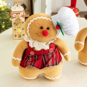 Plush gingerbread gnome in red plaid dress with white chef hat for Christmas decor