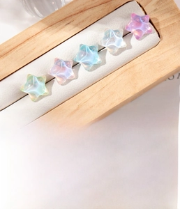 Titanium steel star earrings featuring iridescent resin and 0.8x6mm screw back pins