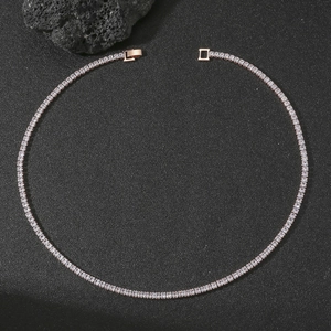 Detailed view of rose gold tennis necklace with square-cut zircons and security clasp