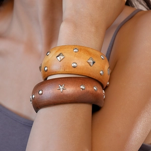 Vintage wooden round bangles with star and geometric metal rivets in natural wood tones