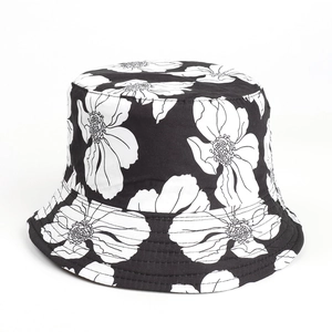 Close-up of black and white floral bucket hat with hand-drawn flower patterns