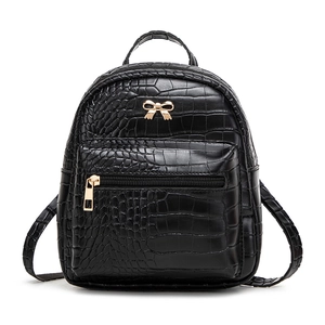 Fashionable black crocodile pattern mini backpack with gold bow accent for women
