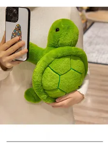 Detail shot of a soft plush turtle pillow with realistic green hexagonal shell texture
