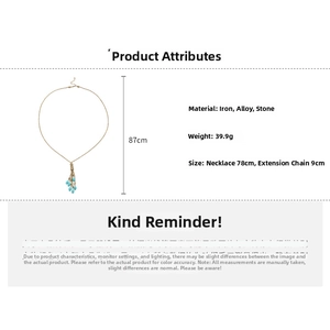 Detail of long bohemian necklace with blue teardrop stone and 87cm gold-tone alloy chain