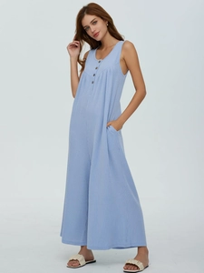 Detail of light blue striped romper featuring sleeveless U-neck and wooden buttons