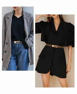 Detail of slim brown leather belt with gold buckle styled on checkered suit and black dress
