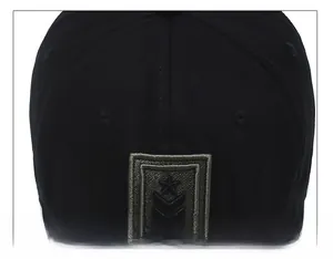 Detail of army star patch and premium stitching on black camouflage tactical baseball cap