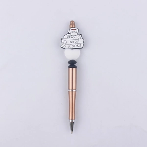 Detail of rose gold beaded pen featuring coffee cup and stacked books silicone charms