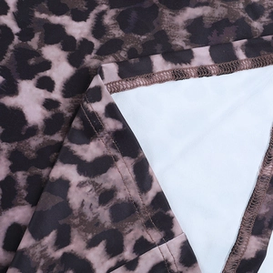Detail shot of leopard print fabric showing stitching and smooth lining quality