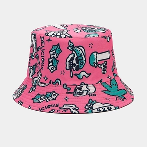 Detailed view of pink cotton bucket hat featuring edgy street graffiti and mushroom prints