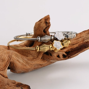 Twisted cable wire bracelet set with diamond flower charms in gold and silver finish