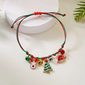 Detailed close-up of handmade woven Christmas bracelet with reindeer and tree charms