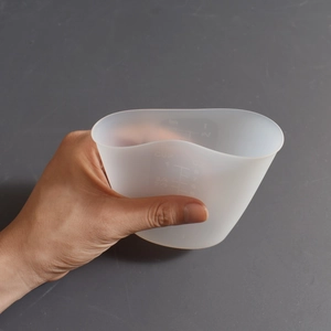 Macro view of flexible silicone measuring cup with clear scales for DIY resin casting