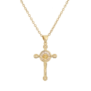 Close-up of gold-plated cross pendant necklace featuring central crucifix and clear gems