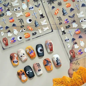 Halloween nail art stickers with pumpkin and ghost designs on varied base colors