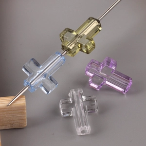 Transparent crystal cross beads in yellow, blue, and purple for DIY jewelry making