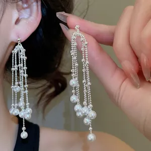 Elegant silver tassel drop earrings with white pearls and sparkling zircon accents