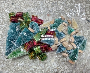 Miniature sisal Christmas trees and red-green gift box ornaments in clear packaging