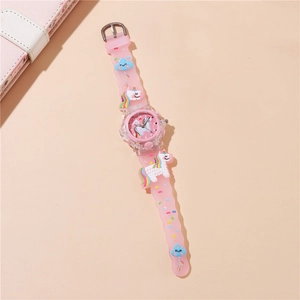 Detail of pink cartoon unicorn kids watch with flexible silicone strap and LED light