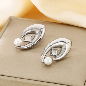 Detail of silver stainless steel earrings with square diamond and white pearl accents