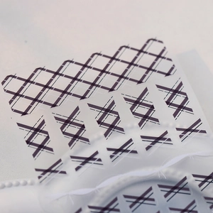 Japanese retro plaid nail art stickers with purple geometric stripes and dark grid design