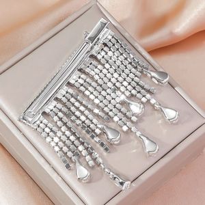 Sparkling silver tassel hair clip with long rhinestone chains on pink silk