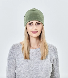 Close-up of olive green beanie hat showing soft fleece texture and snug fit design