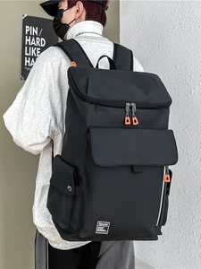 Black high-capacity waterproof nylon backpack with orange zippers for travel and fitness