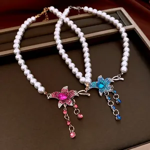 Vintage pearl necklace with starfish rhinestone pendants and tassels in French style
