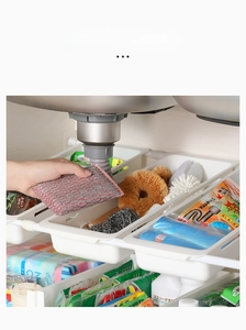 Adjustable white under-sink storage rack with DIY expandable tiers and slide-out baskets