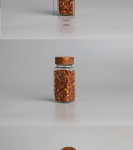 Detail view of a 120ml square glass spice jar with acacia wood lid and size dimensions