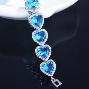 Luxury heart-shaped sea blue carbon diamond bracelet in high-polished silver finish