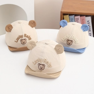 Detailed embroidery of Lucky Baby and cute bear ears on breathable cotton infant sun caps