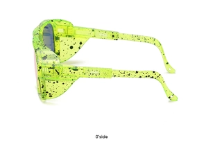 Side view of fluorescent green sports sunglasses with black paint splatter details