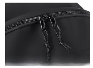 Macro detail of high-quality smooth dual metal zippers with black woven pulls on backpack